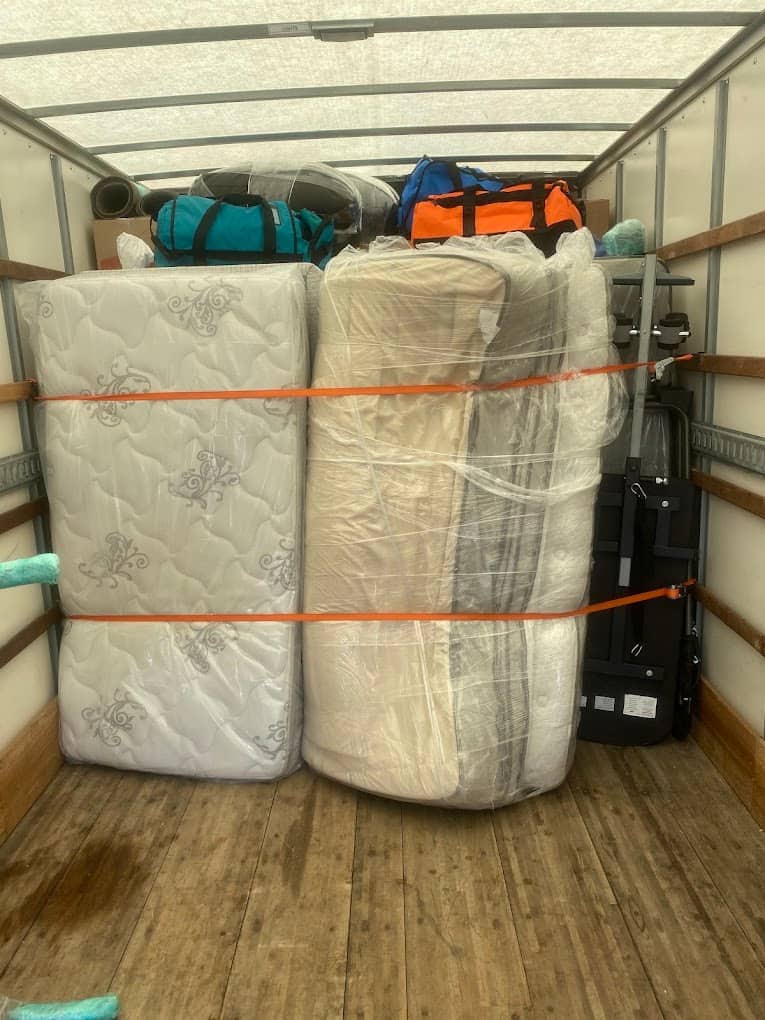 Fully loaded Movers and More moving truck with belongings secured